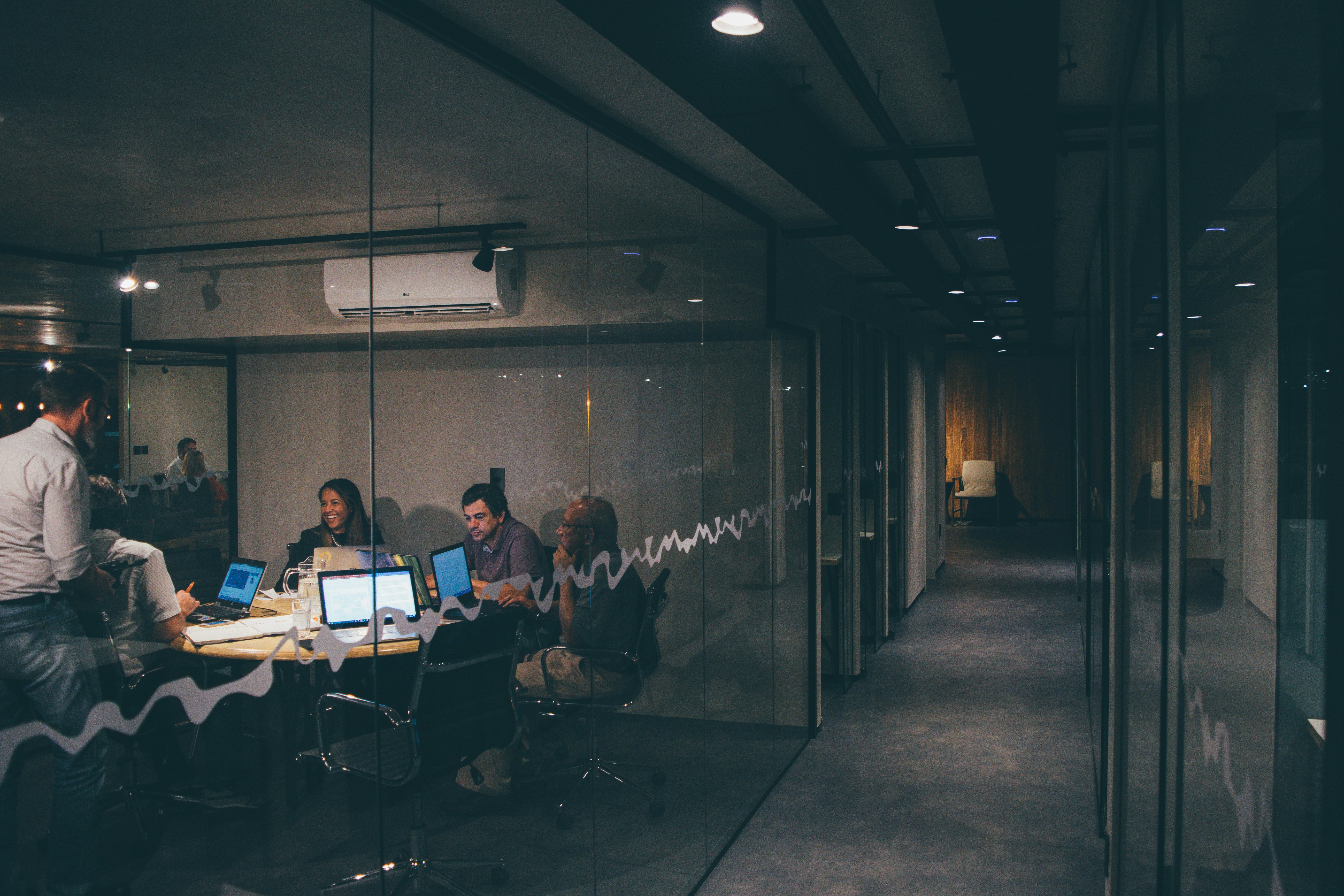 Professional financial advisory team collaborating in a modern office setting.
